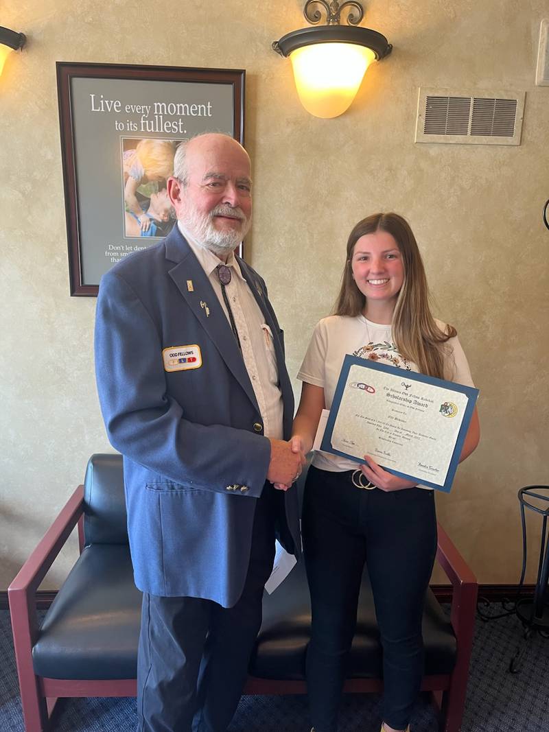 The Grand Lodge of the Illinois Odd Fellows announced (right) Elly Bedecker, a recent graduate of Streator High School, won their $1,000 scholarship. She is congratulated by Dan Davis from the Illinois Odd Fellows.