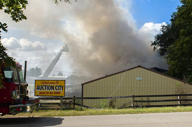 Firefighters battle a blaze at the 300 block of Cropsey avenue in Dixon on Monday, Sept. 26, 2022. Breaking out at Auction City, responders from Dixon, Rock Falls, Polo, Sterling, Amboy, Oregon and Mt. Morris responded to the the alarms.