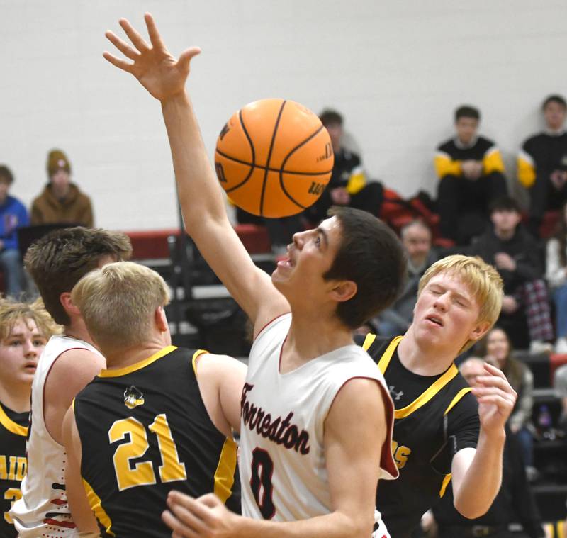 Forreston's Joseph Kolber battles for a loose ball against AFC on Saturday, Jan. 17, 2026 at Forreston High School.