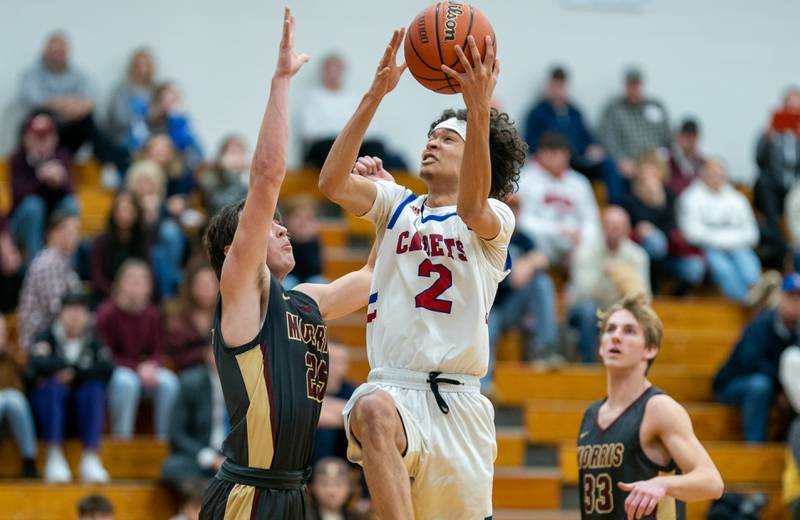 Marmion's Jabe Haith (2) shoots the ball in the post against Morris’ Brett Bounds (25) during the 59th Annual Plano Christmas Classic basketball tournament at Plano High School on Tuesday, Dec 27, 2022.