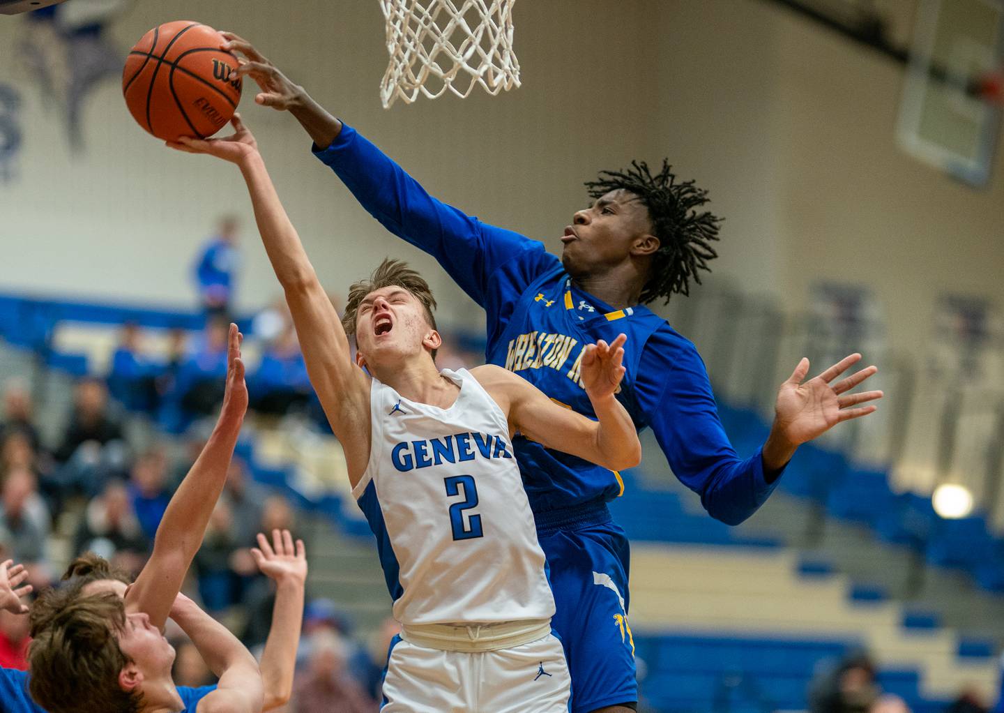 Wheaton North's Jalen Crues (33) blocks a shot attempt by Geneva’s Michael Lawrence (2) during a basketball game at Geneva High School on Friday, Jan 6, 2023.