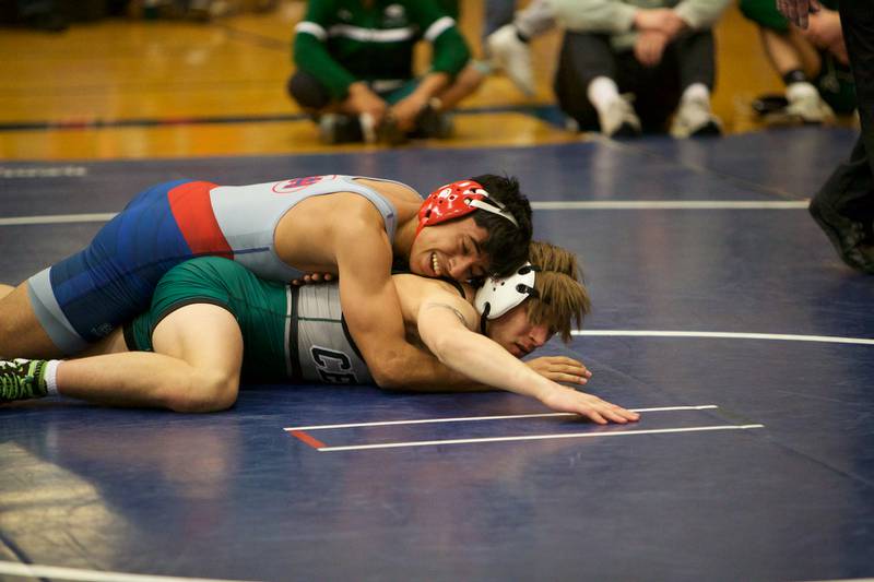 Plainfield Central's Gavin Enders competes with West Aurora's Adrian Ortiz in the 138 lb. class at the Newbill Invitational on Saturday, Jan.6,2024 in Geneva.