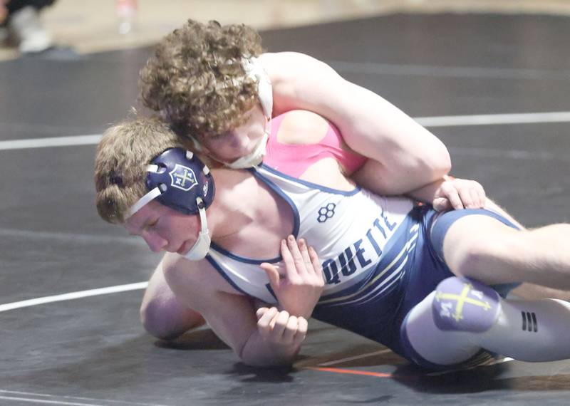 Marquette's Logan Parini wrestles Bradley-Bourbonnias's Coen Mcgill on Wednesday, Jan. 14, 2026 in Bader Gymnasium at Marquette Academy.