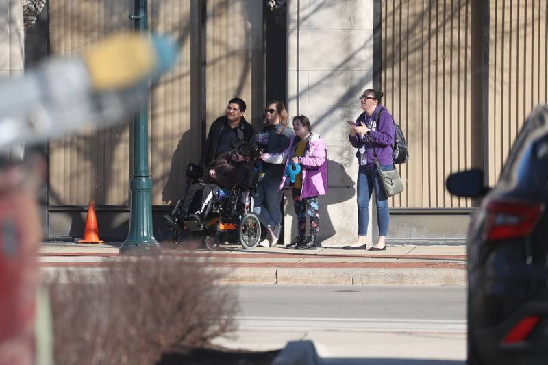 A group watches as work begins on the external demolition of the old Will County Courthouse on Friday, Feb. 9th 2024 in Joliet.