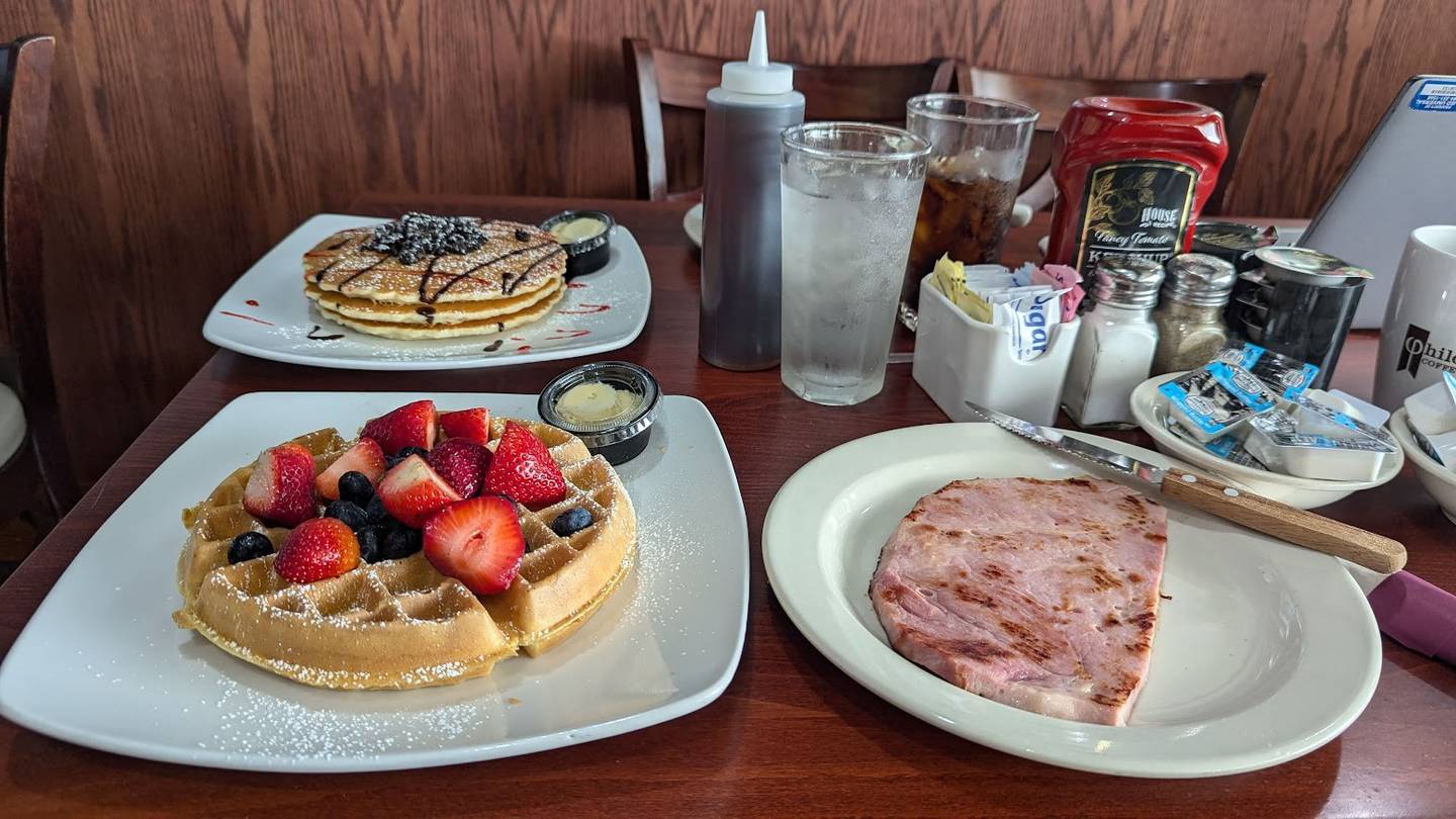 Maple Butter Café in Plainfield has an extensive breakfast and lunch menu. Pictured is the restaurant's signature Oreo pancakes, along with a Belgium waffle with fresh blueberries and strawberries and a slice of ham on Tuesday, October 29, 2024.