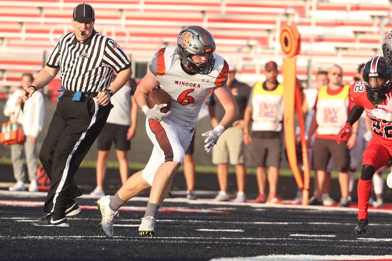 Minooka’s Cayden Garcia heads upfield against Bolingbrook. Friday, Aug. 26, 2022, in Bolingbrook.