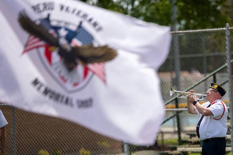 Gary Wood of the Ottawa Honor Guard performs with trumpet during 21-Gun salute on Monday, May 26, 2025 at Washington Park in Peru.