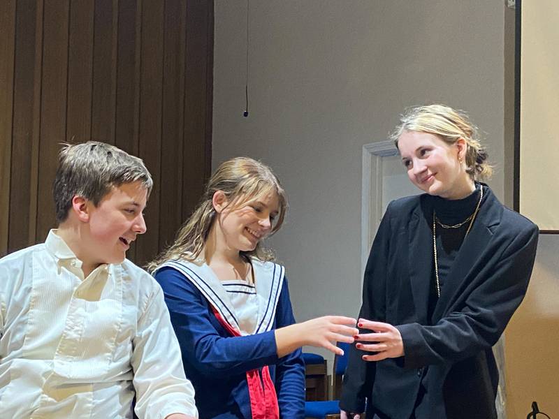 Pictured leading the cast of Princeton Christian Academy's "Our Town" are (right to left) Brooke Clausen as stage manager, Natalie Richey as Emily Webb, and David Lunger as George Gibbs.