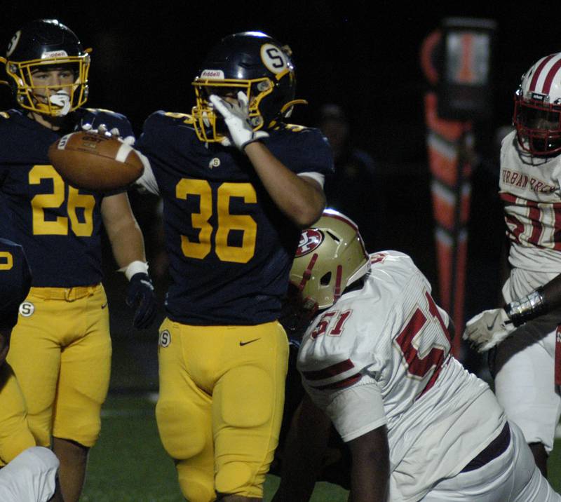 Sterling's Deseo Ibarra-Castillo holds the ball after a fumble recovery.