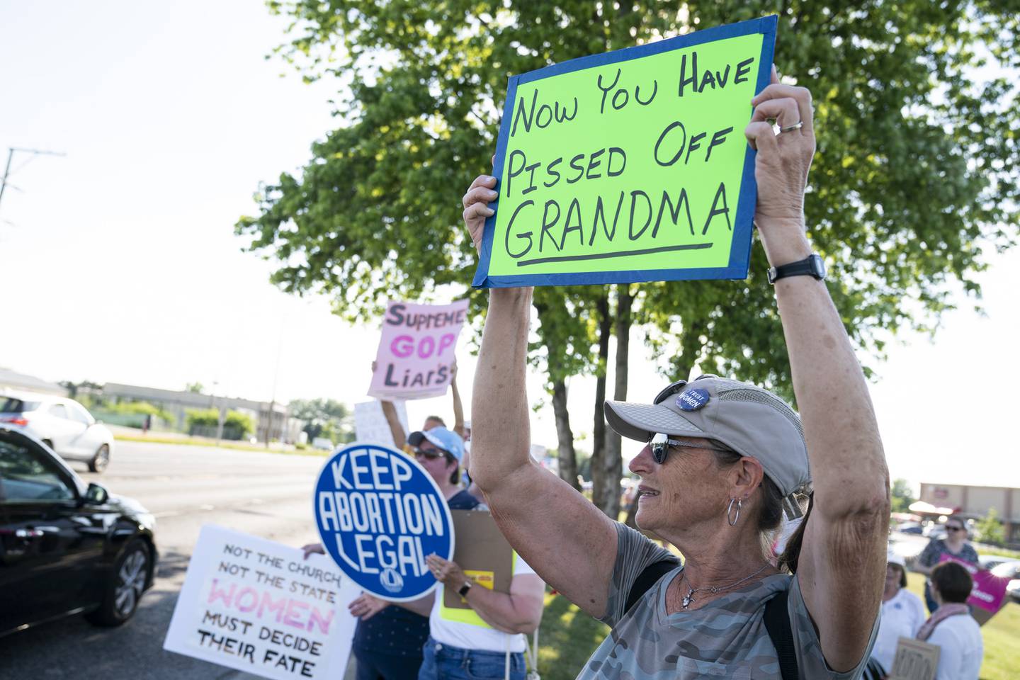Jennifer Galloway, of Huntley, holds a sign for passing traffic during a protest Friday, June 24, 2022, over the overturning of Roe v. Wade, organized by the McHenry County National Organization for Women. On Friday, the U.S. Supreme Court overturned the decades-old ruling that upheld the right to an abortion.