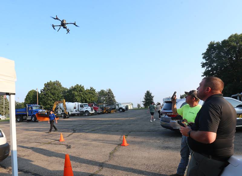 Chris, Erickson, Investigator at the Princeton Police Department, flys the departments DJI Matrice 300 RTK drone during the National Night Out event on Tuesday, Aug. 5, 2025 at Zearing Park in Princeton. The event featured K-9 and drone demonstrations, Mr. Cinnamon balloon twister, face painting, emergency vehicles, and more. National Night Out is an annual community policing campaign held on the first Tuesday of August to create police-community partnerships and build safer neighborhoods.