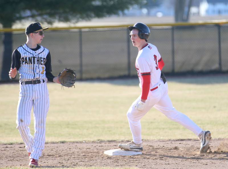 Hall's Jack Jabolnski steps on second base as Putnam County's Maddox Poole watches the ball roll into the outfield on Monday, March 17, 2025 at Putnam County High School.