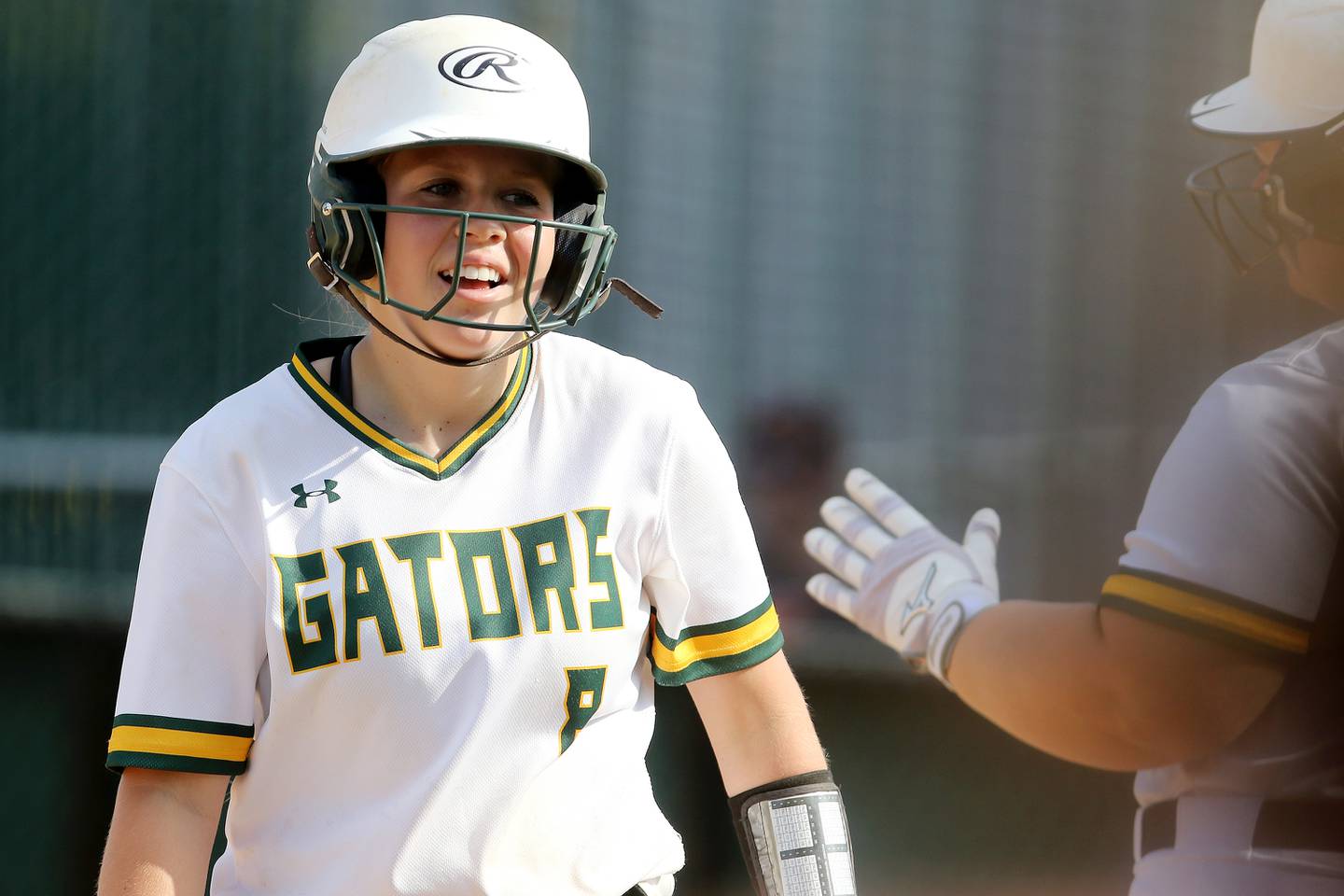 Crystal Lake South's Kennedy Grippo is all smiles heading into a sea of high-fives from the dugout after scoring against Woodstock North during their IHSA Class 3A Softball regional championship at Crystal Lake South High School on Thursday, June 3, 2021 in Crystal Lake. Crystal Lake South won 8-0 through 7 innings of play.