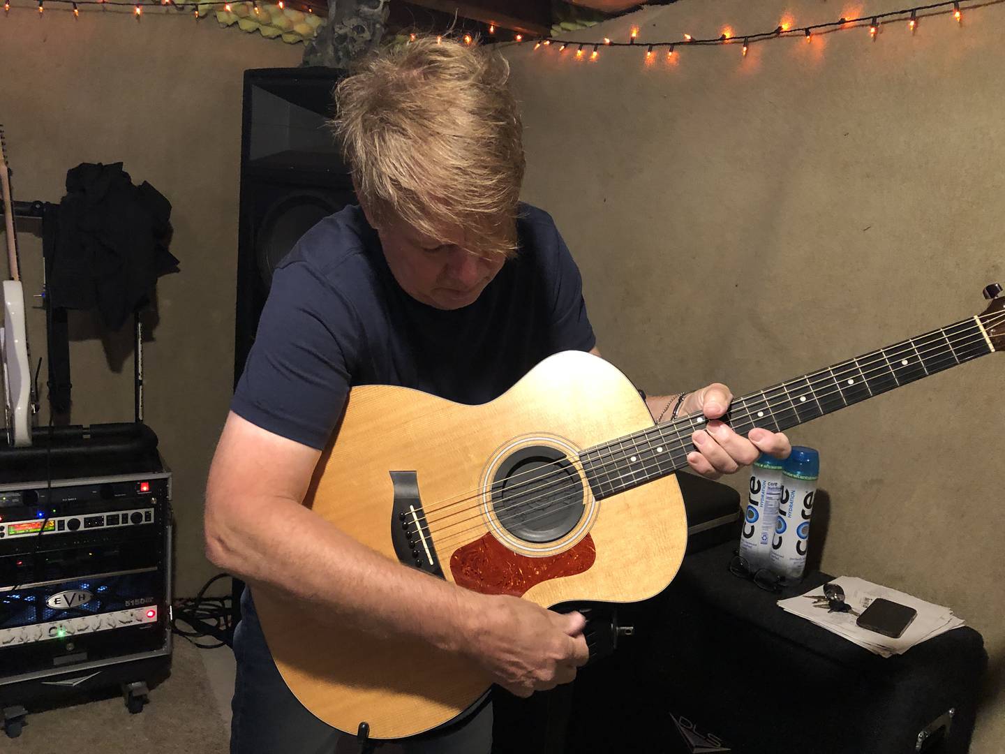 Dannie Schramm gets his guitar ready for Moon's last practice on Wednesday, July 23, 2025, before the band plays a 45th anniversary show Saturday at The Vixen in McHenry.