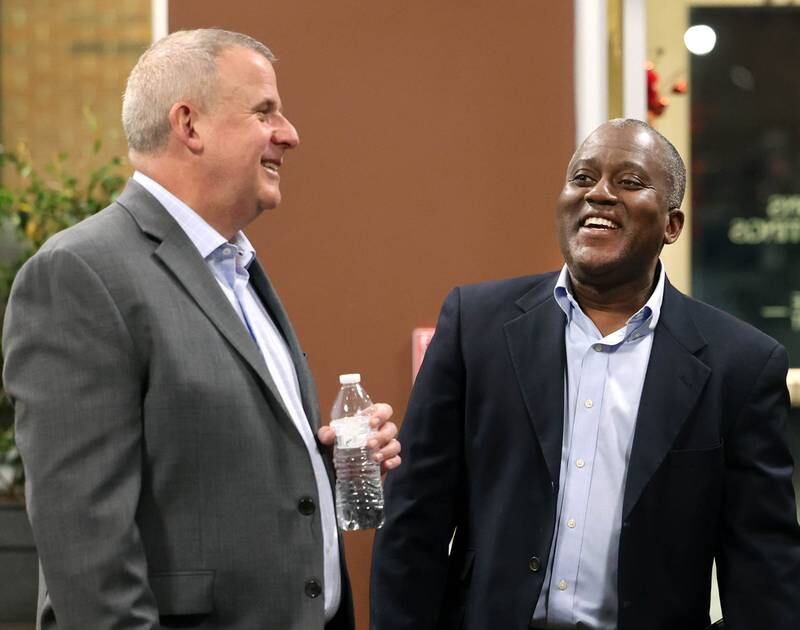 Current DeKalb Mayor Cohen Barnes, (left) who is running for re-election, talks to one of his opponents in the race for mayor Kouame M. Sanan Wednesday, Feb. 19, 2025, at the DeKalb Area Rental Association and DeKalb Area Builders Association Candidate Night at Faranda's Banquet Center in DeKalb. Other candidates vying for the DeKalb mayor position in April are current 7th Ward Alderman John. B. Walker and Linh Nguyen.