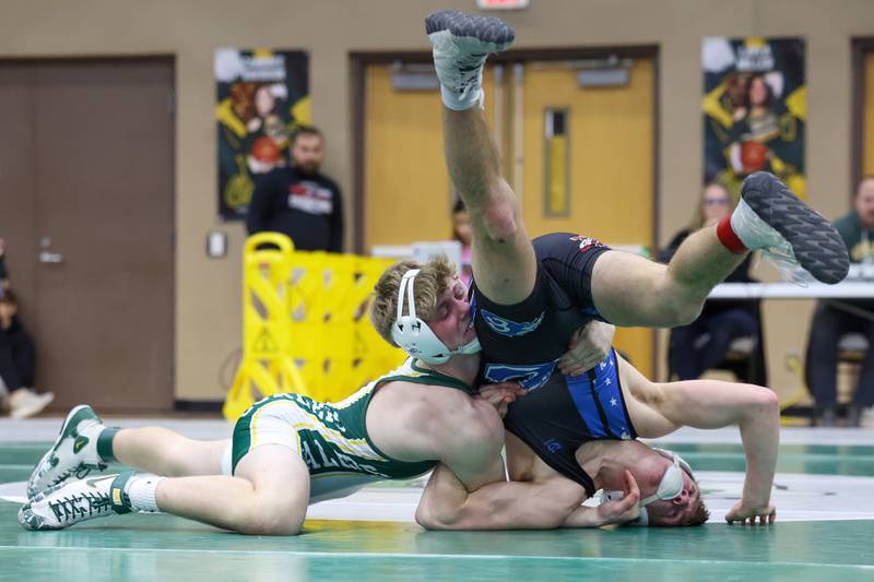 Coal City's Max Christensen, left, wrestles Clifton Central's Evan Cox in the 144-pound championship match during the IHSA Class 1A Coal City Sectional on Saturday, Feb. 14, 2026.