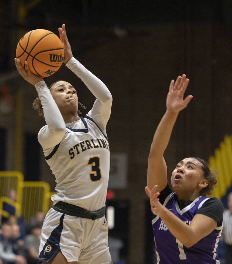 Sterling’s Delali Amankwa puts up a shot against Rochelle’s Carmela Bright Monday, Feb. 17, 2025, during the girls 3A regional semifinal game in Sterling.