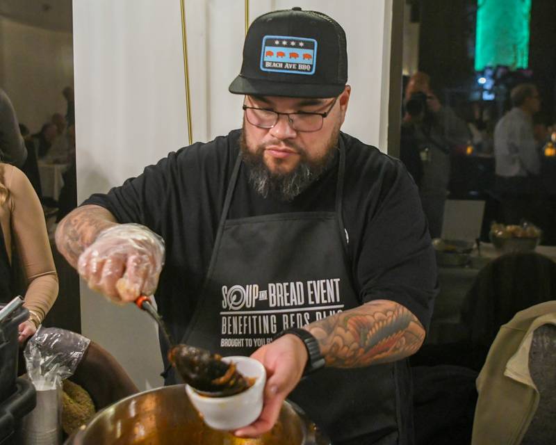 Juan Silva dishes out a cup of Abuela’s Chicken Tortilla during the Soup and Bread fundraiser event that benefited Beds Plus on Sunday Feb. 2, 2025, held at the Holiday Inn Banquet Center in Countryside.