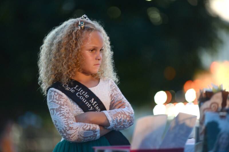 2024 Little Miss Ogle County, Talia Pope, 7, of Oregon, watches the Ogle County Fair Pageant on Wednesday, July 31, 2024.