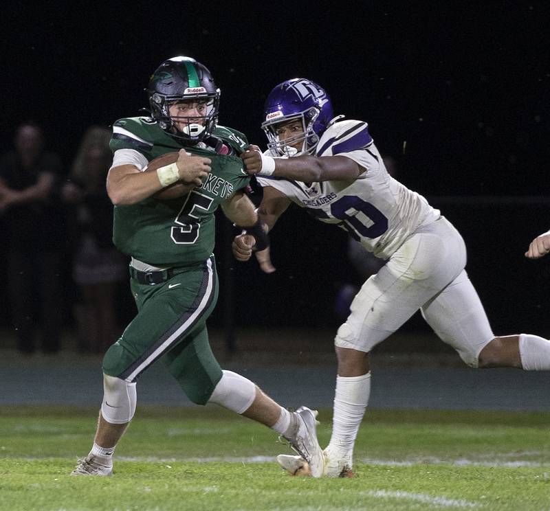 Rock Falls’ Mason Landes is chased by a Rockford Lutheran defender Friday, Sept. 20, 2024, at Hinders Field in Rock Falls.