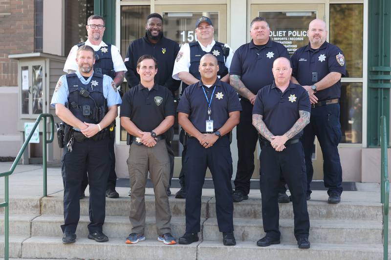Joliet Police Sergeant Chad Evans, bottom right, stands with fellow members of Battle Buddies on Wednesday, Oct. 18, 2023 in Joliet. Evans started Battle Buddies program at the department in 2016 to provide support and meet the needs of veterans.
