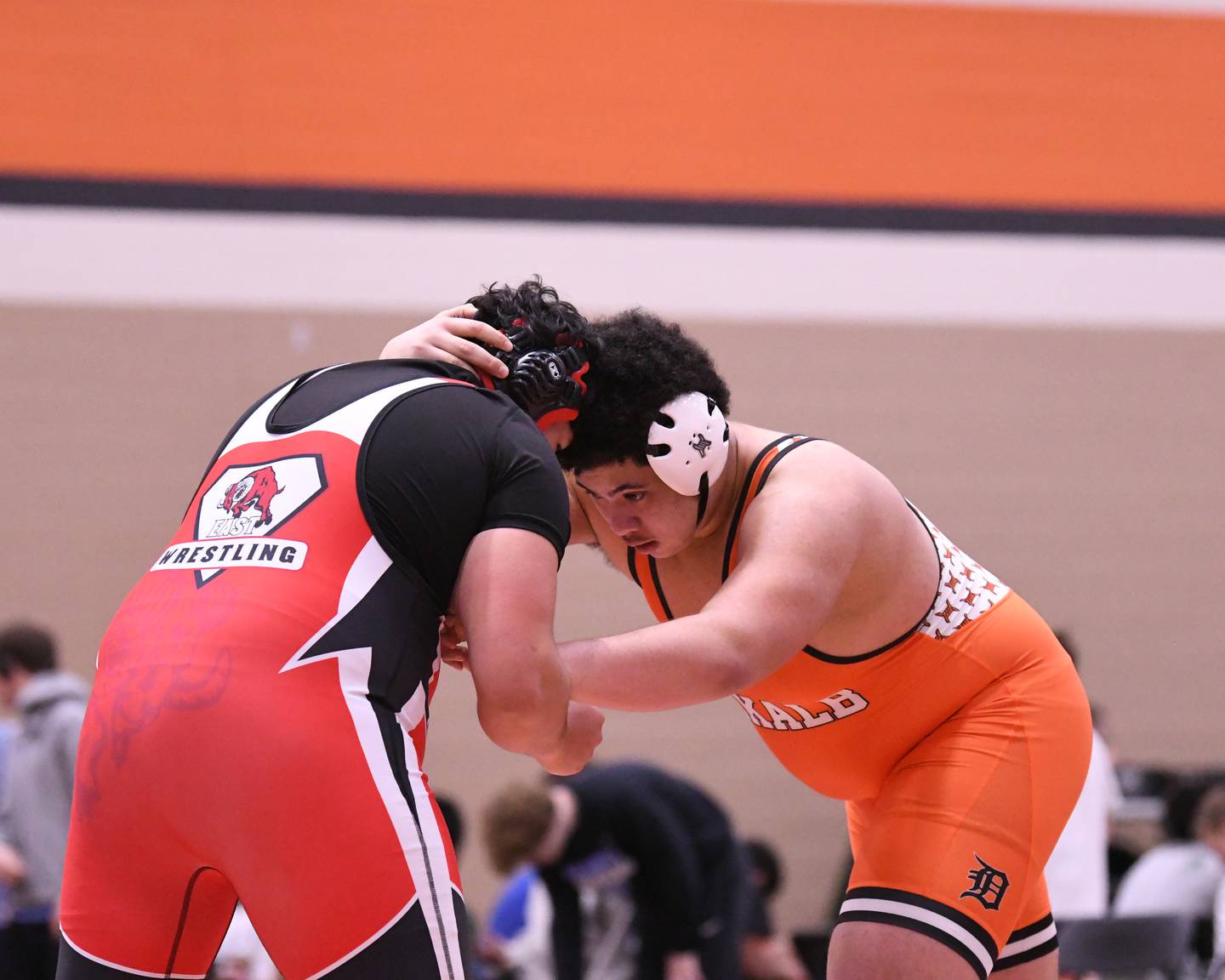 Jayden Coleman, right, of DeKalb keeps a hold of Glenbard Eas's  Ricardo Alanis during the 285-weight class on Tuesday Dec. 30, 2025, held at DeKalb High School.