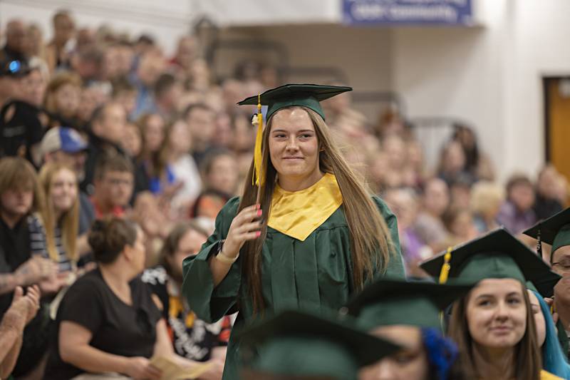 Class of 2023 representative Katie Thatcher approaches the stage to give her speech during Rock Falls High School’s graduation ceremony Sunday, May 28, 2023.