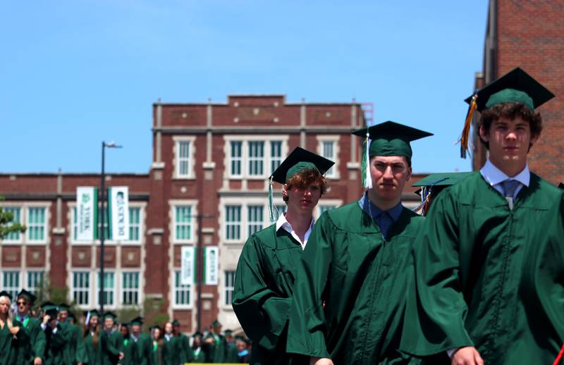 Members of the Class of 2024 marched to the stadium as York High School held its graduation at the school in Elmhurst on Sunday.