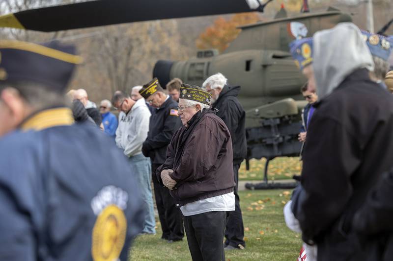 Attendees in Dixon huddle against the cold, breezy weather Tuesday, Nov. 11, 2025, to honor those who serve.