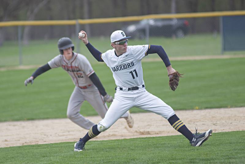 Sterling's Justin Null throws to first for an out against Forreston on Monday, May 2, 2022.