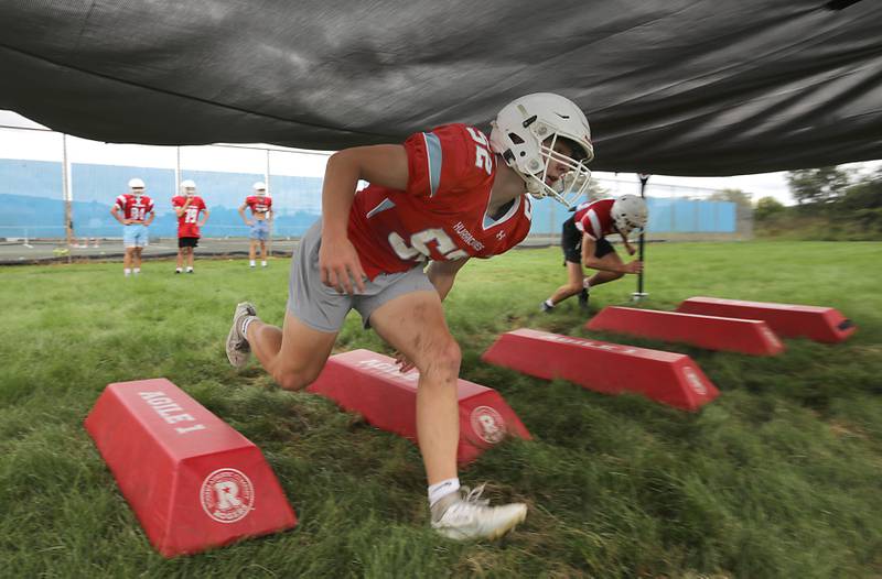 Marian Central’s Dan French runs through a rushing drill during football practice on Tuesday, August 19, 2025, at Marian Central  High School in Woodstock.