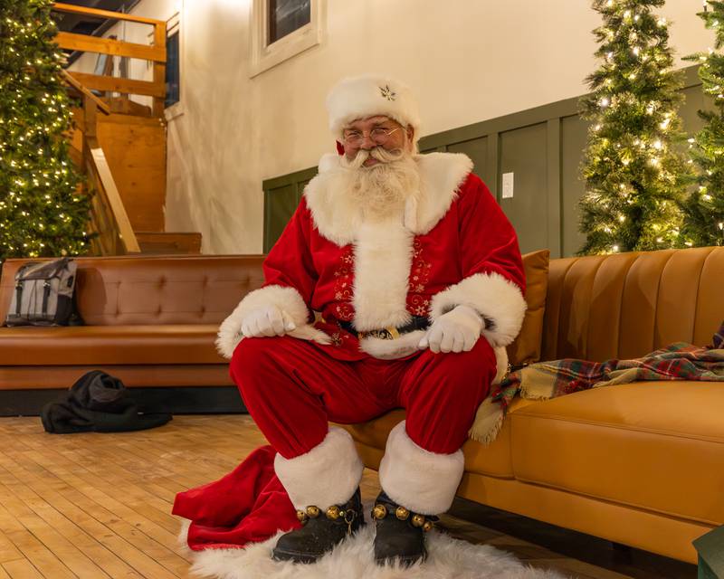 Santa poses for photo as he awaits visitors on Sunday, December 14, 2025 at The Coffee Barn in Mendota.