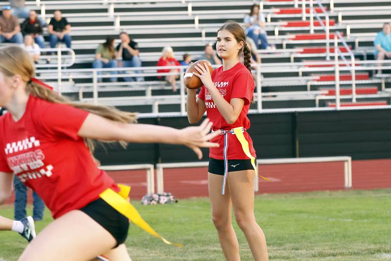 Erie High School freshman Ava Johnson looks for an open receiver Wednesday, Oct. 1, 2025, during the Powder Puff football tournament. EHS girls competed together by class to determine who would win bragging rights as the 2025 EHS Powder Puff Champions as part of the school's Homecoming festivities this week. The senior class of 2026 ultimately took home the trophy.