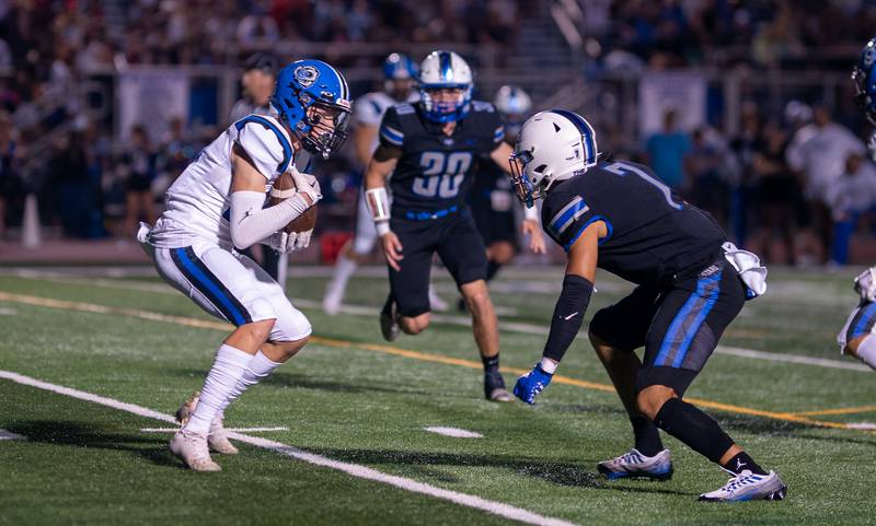 Lake Zurich's Jackson Piggott (19) catches a pass against St. Charles North during a football game at St. Charles North High School on Friday, Sep 2, 2022.