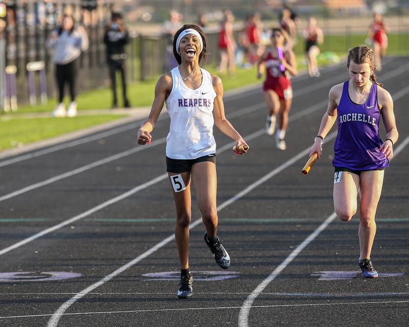 Plano's Tomi Ashaye anchors for the win in the 4x200 relay during the Interstate Eight conference meet at Plano High School.  May 9.2022