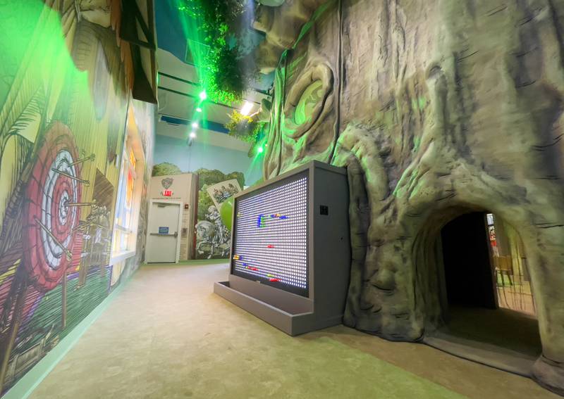 Tunnels, slides and a large light board are part of the Exploration Station's new Storybook Forest exhibit on Monday, June 23, 2025, during its grand opening event.