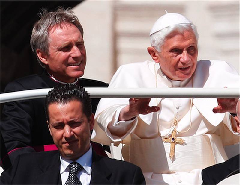 Pope Benedict XVI arrives in St. Peter's square in May at the Vatican for a general audience as his then-butler Paolo Gabriele (bottom) and his personal secretary Georg Gaenswein sit in the car with him. Pope Benedict XVI's ex-butler Paolo Gabriele and another Vatican lay employee, Claudio Sciarpelletti, are scheduled to go on trial Saturday, Sept. 29, 2012, in the embarrassing theft of papal documents that exposed alleged corruption at the Holy See's highest levels.