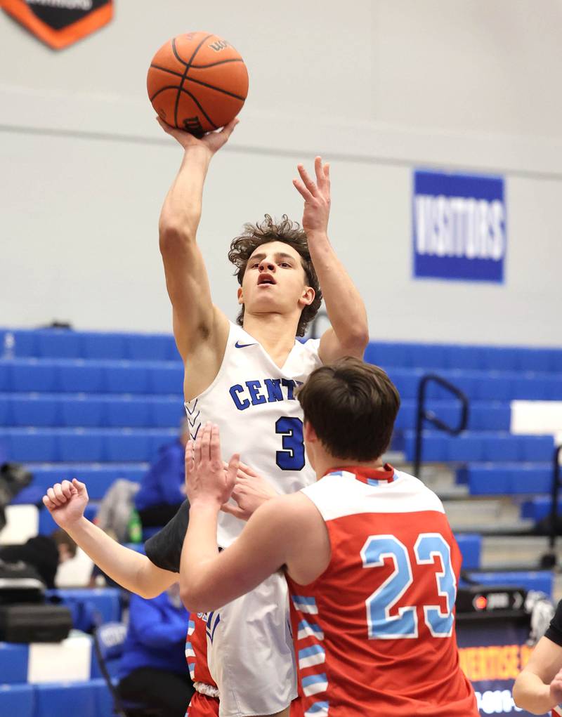 Burlington Central's LJ Kerr shoots over Marian Central's Cale McThenia Monday, Jan. 15, 2023, during their game in the Burlington Central Martin Luther King Jr. boys basketball tournament.