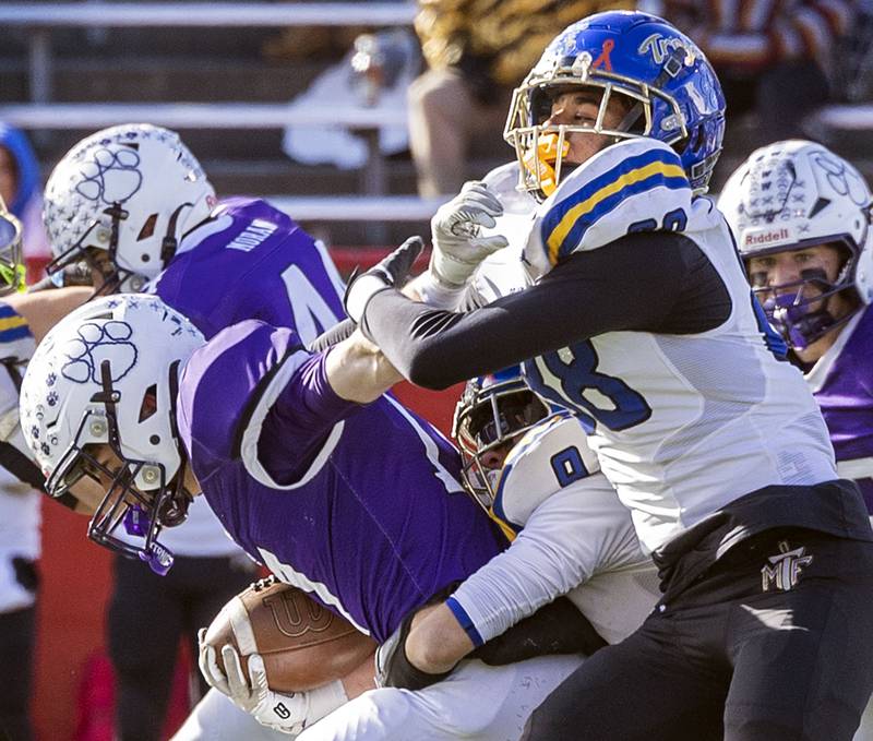 Wilmington's Nate Cupples fights for yards against Maroa-Forsyth's Isaiah Bohlmann Friday, Nov. 28, 2025, in the Class 2A football finals at Hancock Stadium at ISU.