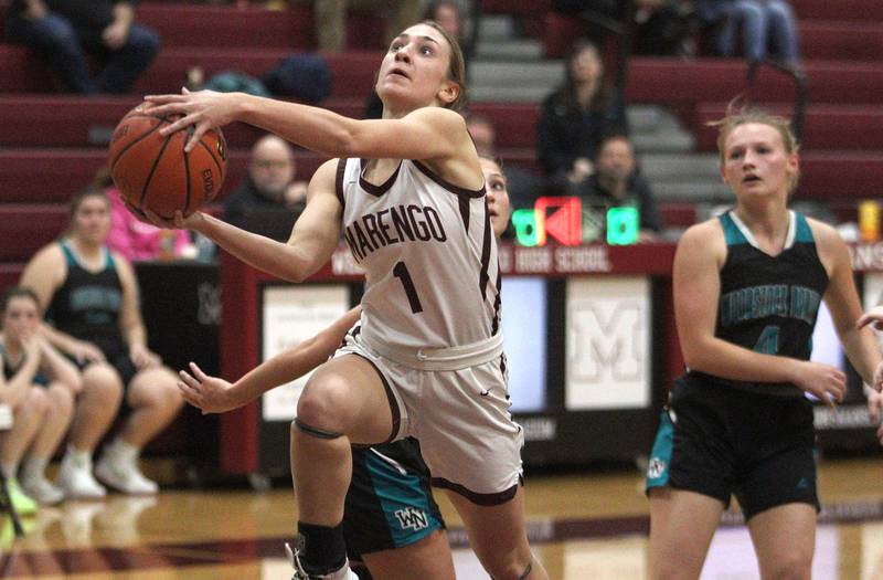 Marengo’s Emily Kirchhoff goes to the hoop against Woodstock North in varsity girls basketball at Marengo Tuesday evening.