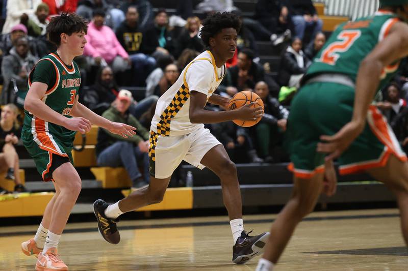 Joliet West’s Abrey Robinson looks for a play against Plainfield East on Friday, Dec. 19, 2025 in Joliet.