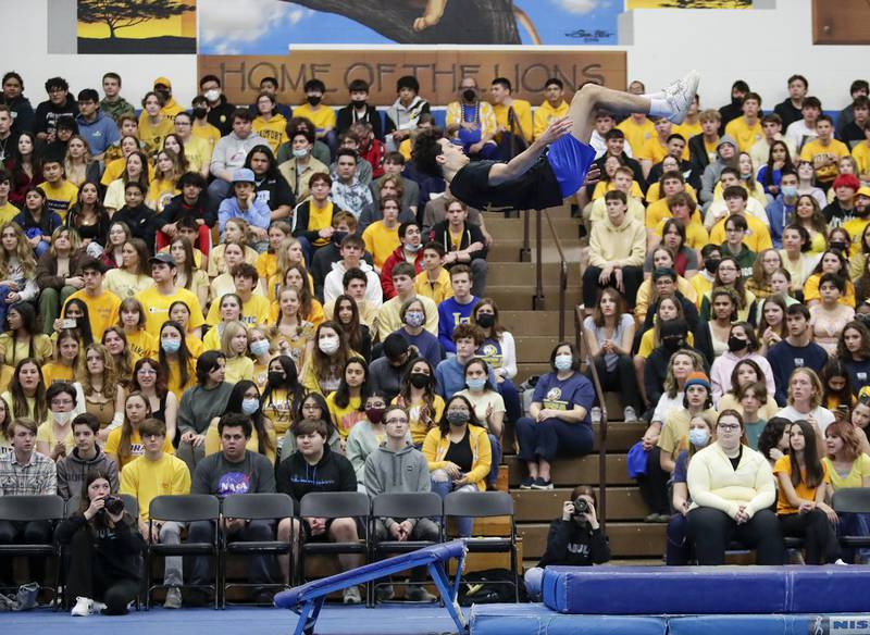 Lyons Township students watch the boys gymnastics team perform during an all-school assembly in La Grange on Friday, April. 22, 2022.