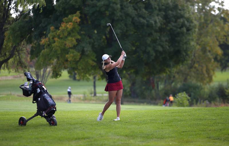 Prairie Ridge’s Grace Mertel hits from the fairway during the Class 2A Waubonsie Valley Girls Golf Sectional on Monday, Oct. 6, 2025 at Springbrook Golf Course in Naperville.