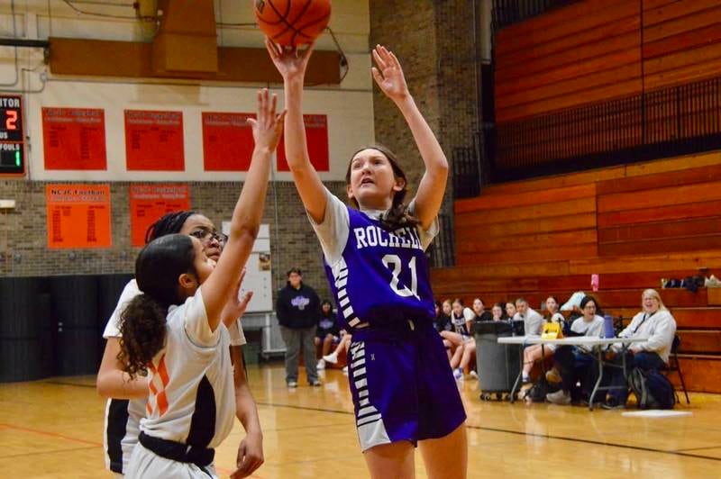 Rochelle's Eve Simms (21) puts up a shot during a seventh grade girls basketball game in DeKalb.
