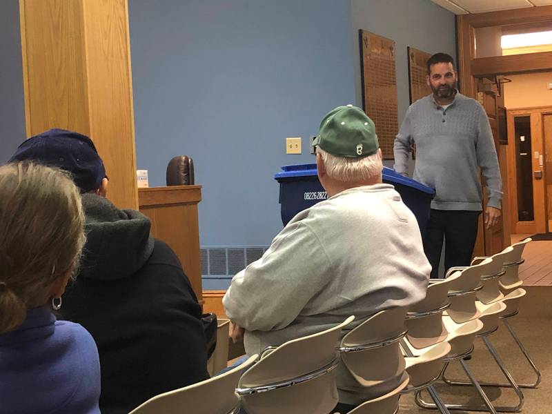 La Salle Finance Director John Duncan demonstrates the mobility of the new trash bins Thursday, Oct. 28, 2022, which will be provided by Lakeshore Recycling Systems as part of La Salle's new garbage service, scheduled to begin this winter.