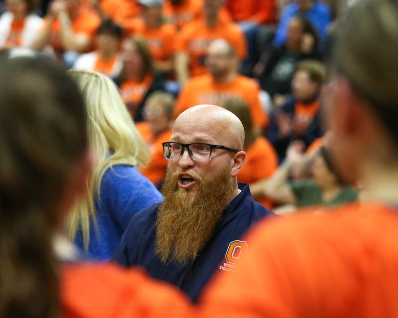 Oswego's head coach Gary Mosley greets the team during a timeout in their Class 4A Bolingbrook Sectional semifinal match between Joliet West at Oswego.  Nov 5, 2024  in Bolingbrook.