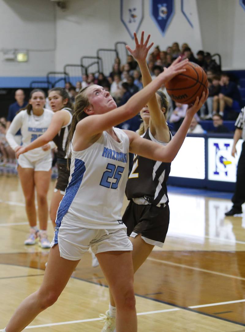 Nazareth's Amalia Dray (25) puts up a shot during the girls varsity basketball game between Carmel High School and Nazareth Academy on Wednesday, Dec. 7, 2022 in LaGrange, IL.