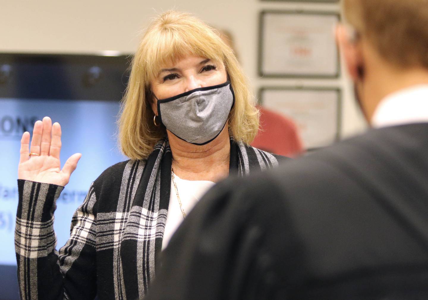 New Dekalb Ward 2 Alderman Barb Larson is sworn by in by 23rd Judicial Circuit Judge Ronald Matekaitis during the City Council meeting Monday, May 10, at the DeKalb Public Library.