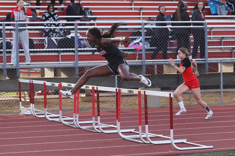Momence's Ania Hawkins keeps her lead in the 100-meter hurdles during the Boilermaker Invite on Thursday, April 3, 2025.