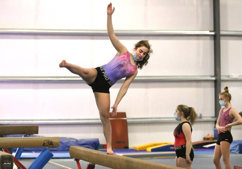 DeKalb-Sycamore co-op gymnastics freshman Joscelyn Dieckman makes a nice save after a move on the beam Wednesday during practice at Energym in Sycamore.